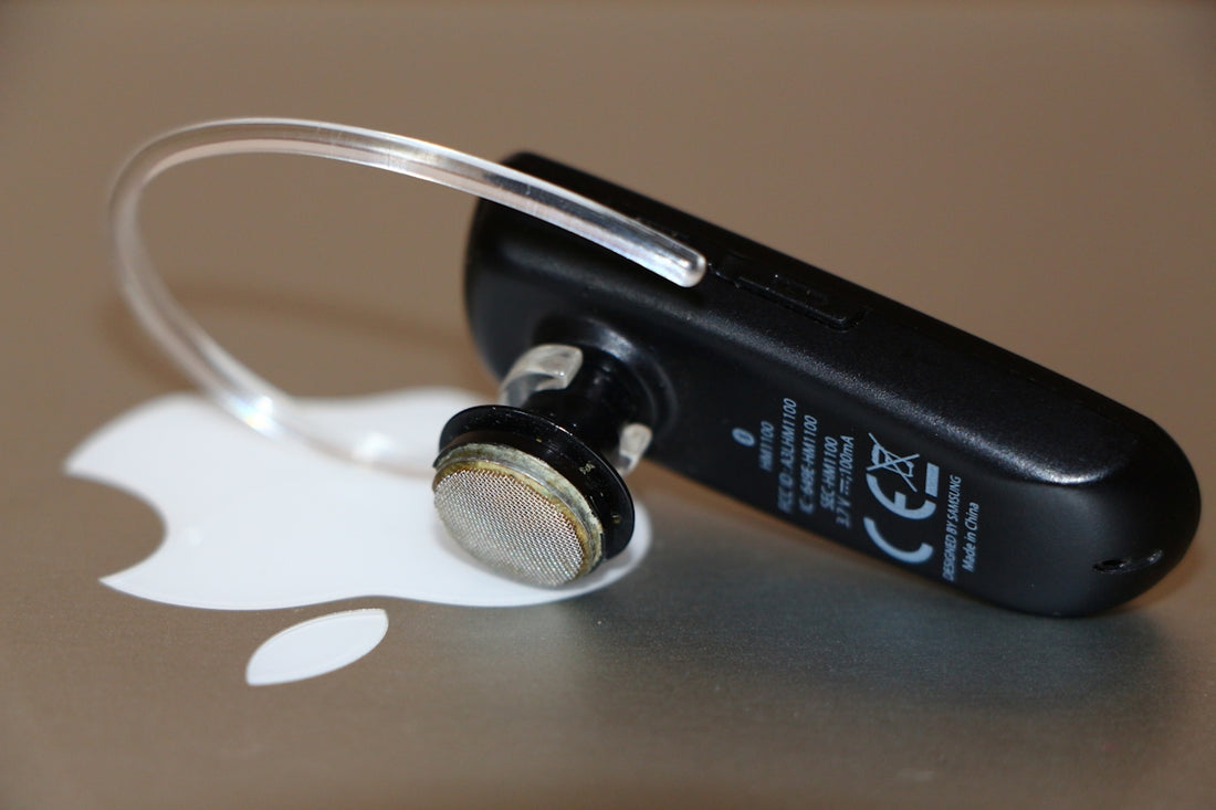 black and silver bluetooth earphones