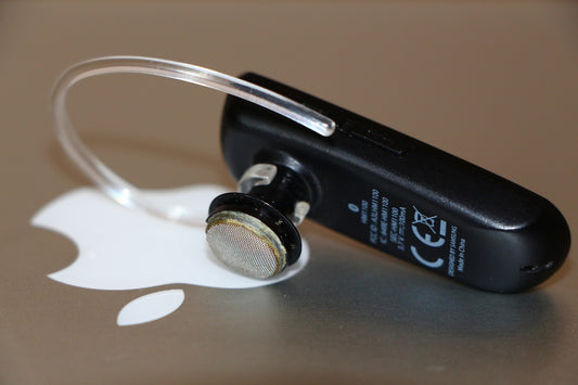 black and silver bluetooth earphones