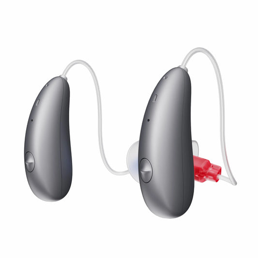 Pair of gray hearing aids on a white background